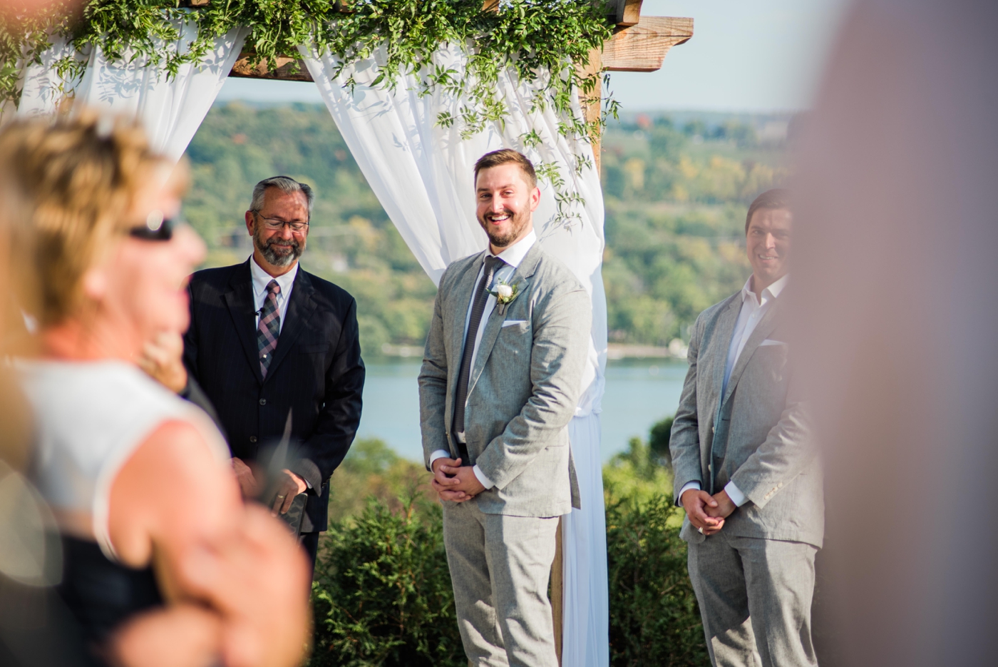 Groom seeing his bride walk down the aisle