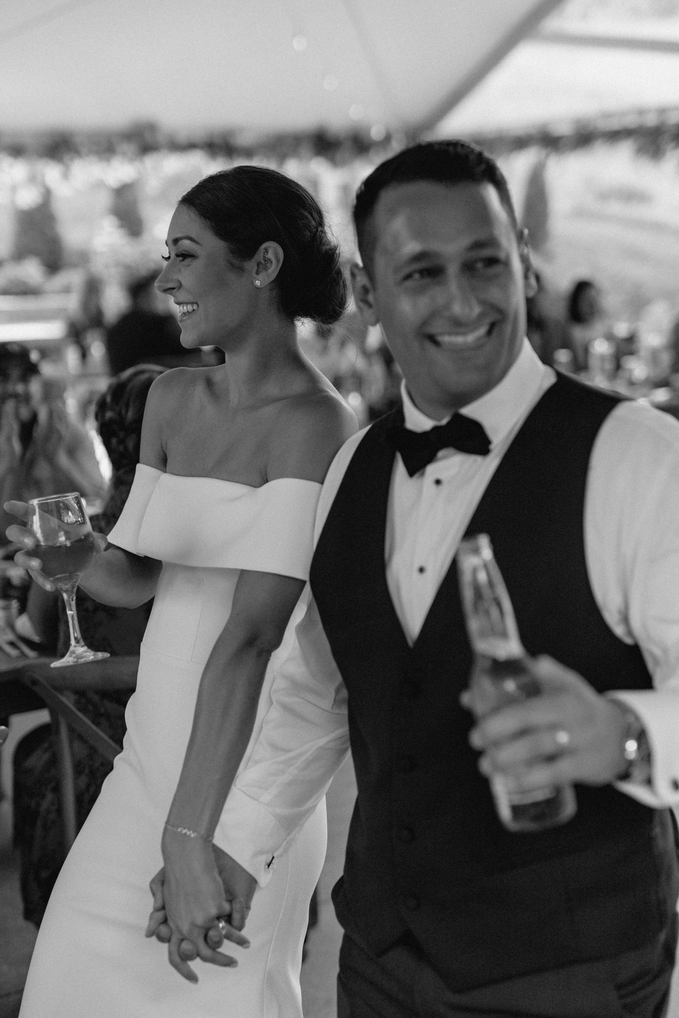 Bride and groom entering their wedding reception