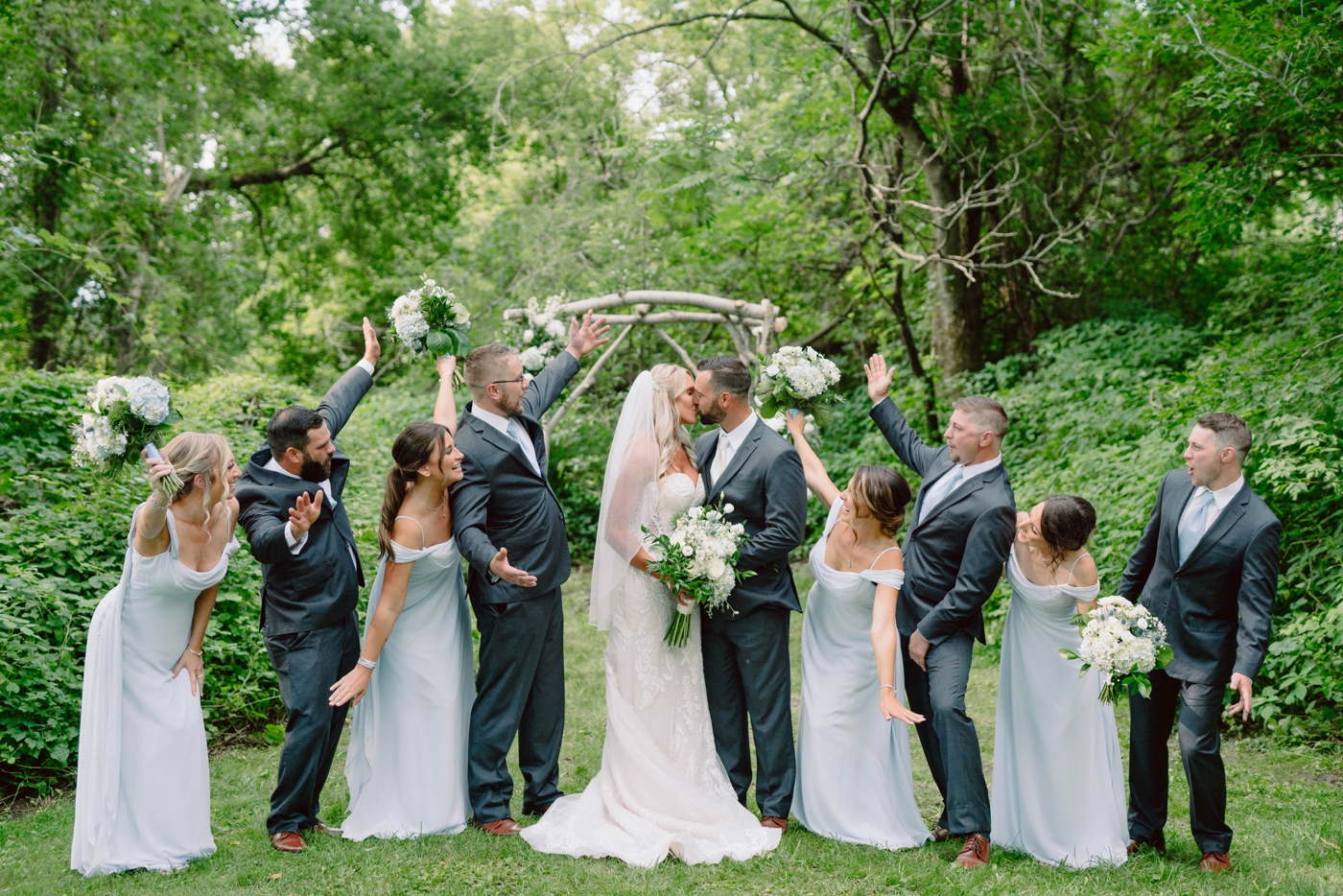 Bridal party portraits at Wolf Oak Acres with bridesmaids in dusty blue dresses