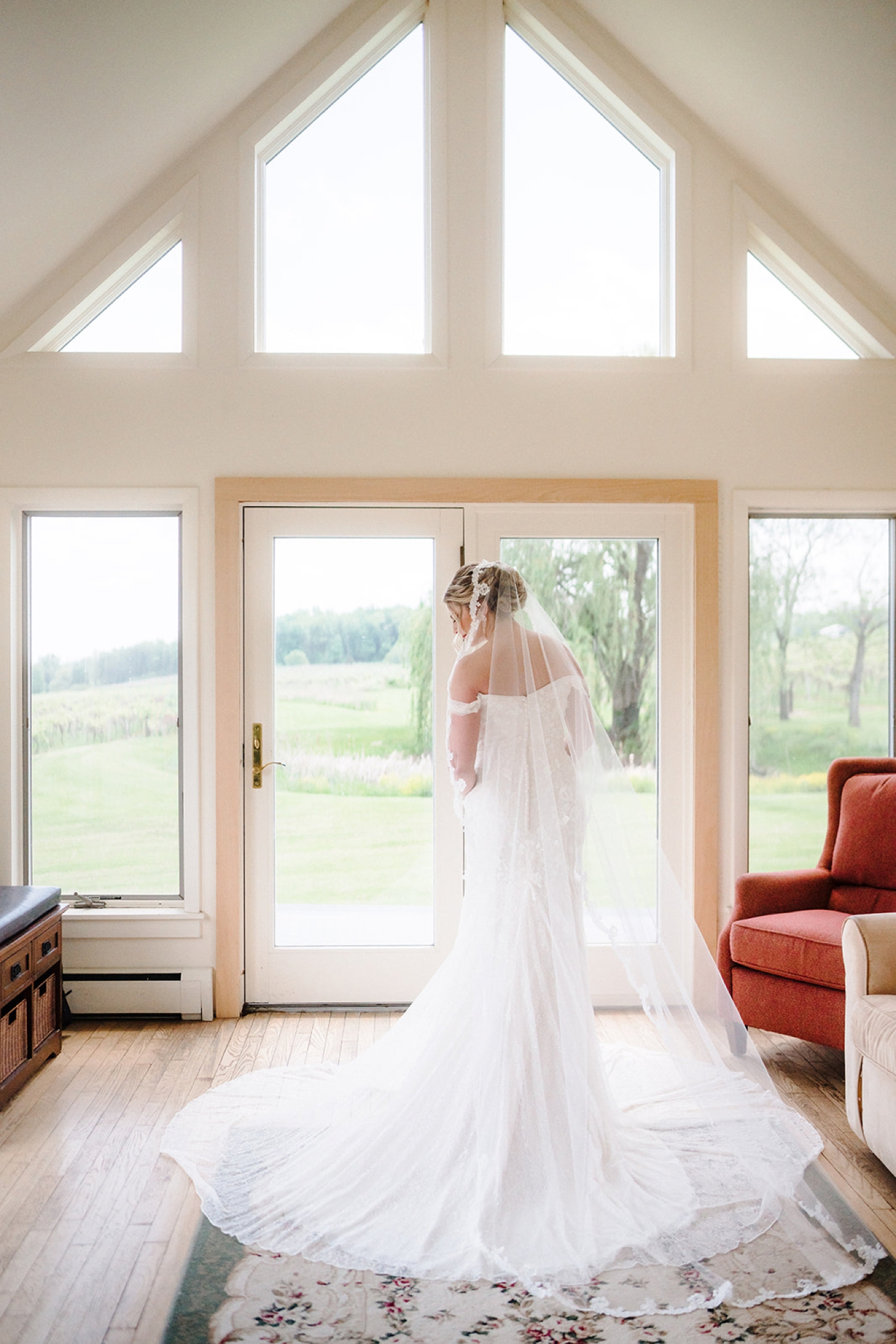 Bride in a lace off-the-shoulder wedding gown from David's Bridal